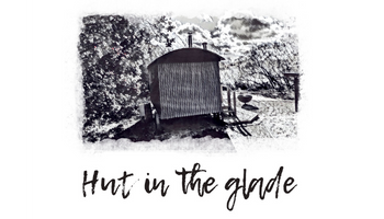 Hut in the Glade logo